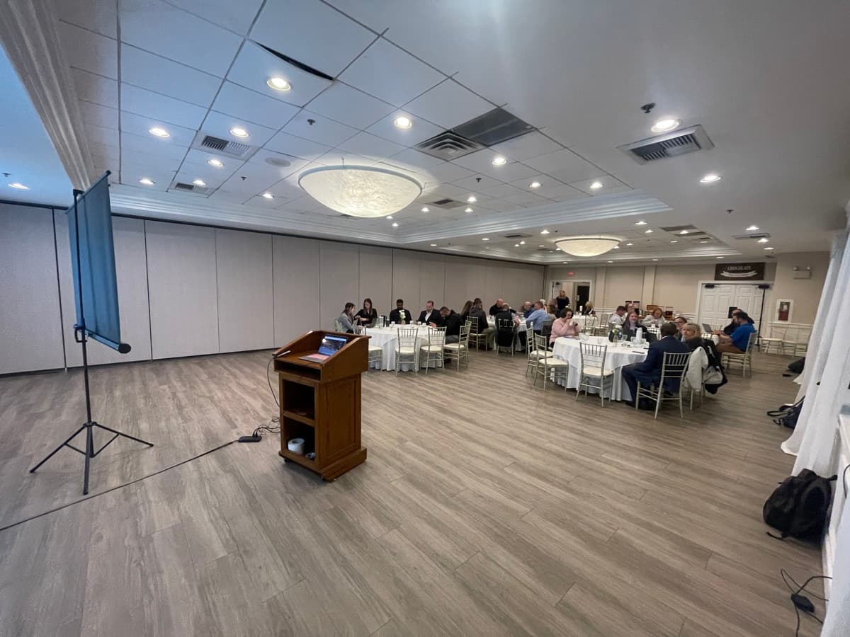 Engaged audience at a PRISM AI speaking event